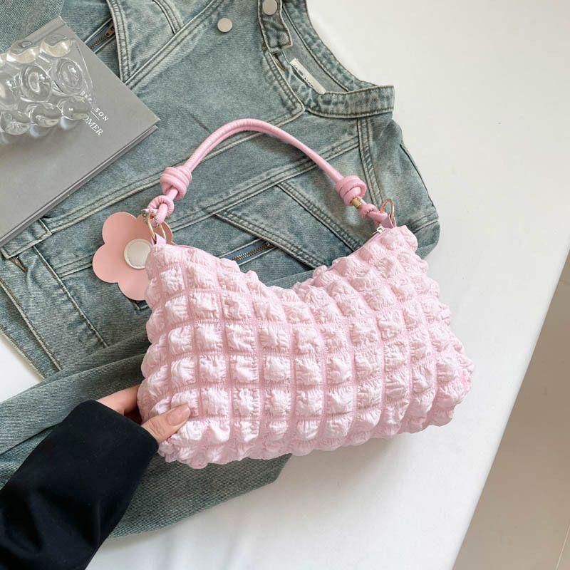 New checkered pleated women's bag with vibrant floral accessories for commuting
