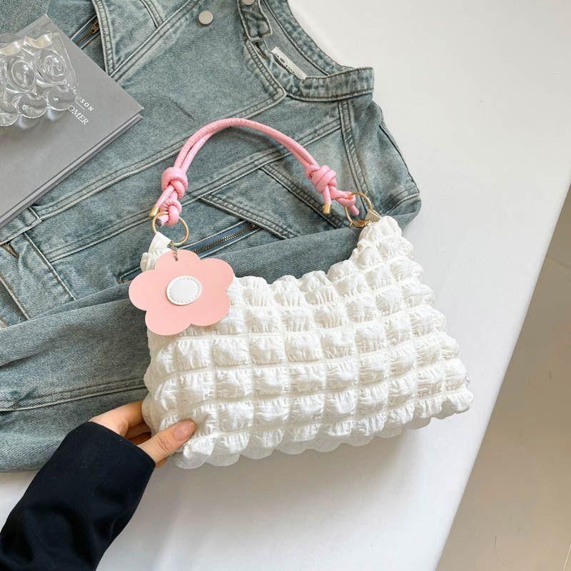 New checkered pleated women's bag with vibrant floral accessories for commuting